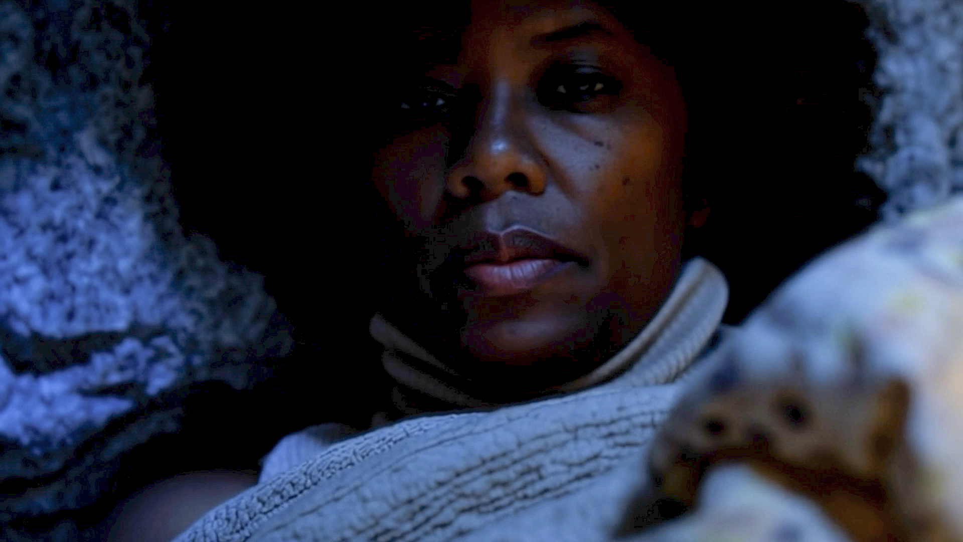 Final documentary frame 2 showing Dana working in bed.
