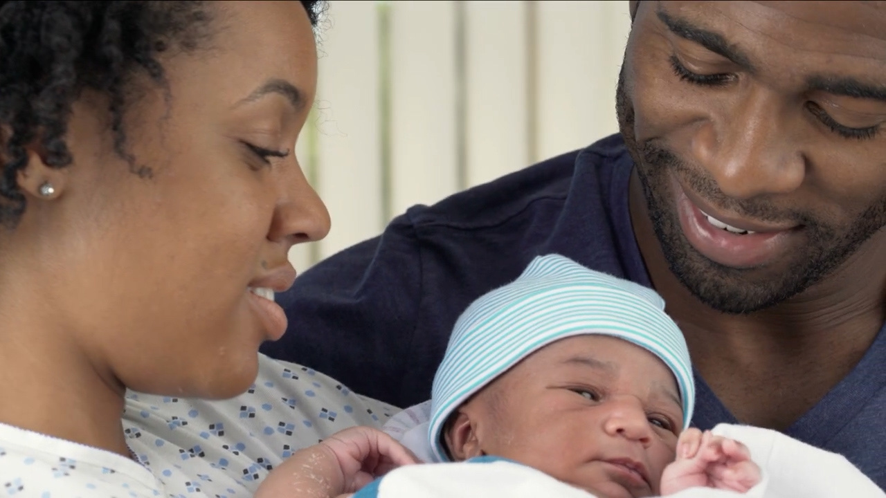 Title frame from Introduction to Early Intervention Services featuring a military family and newborn child.